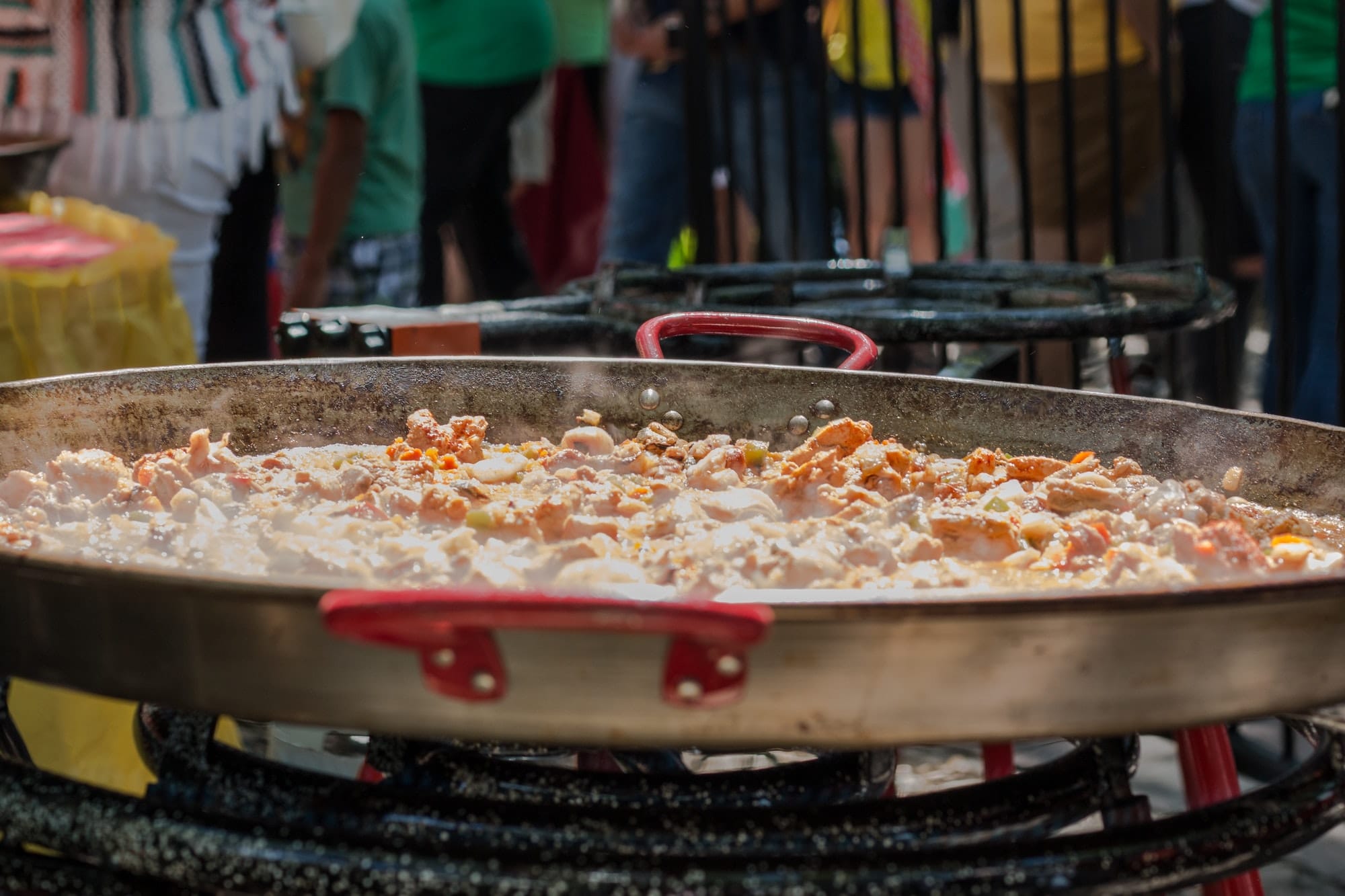 Close up of a pot of hot seafood cooking outdoors at a festival