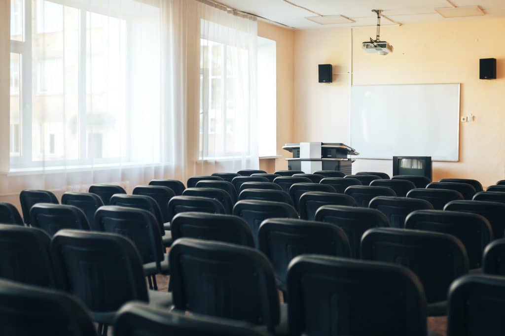 Empty school assembly hall for meetings and presentations, school education